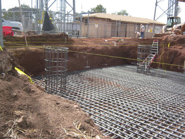 Rebar mat and pier cages for a communications tower foundation